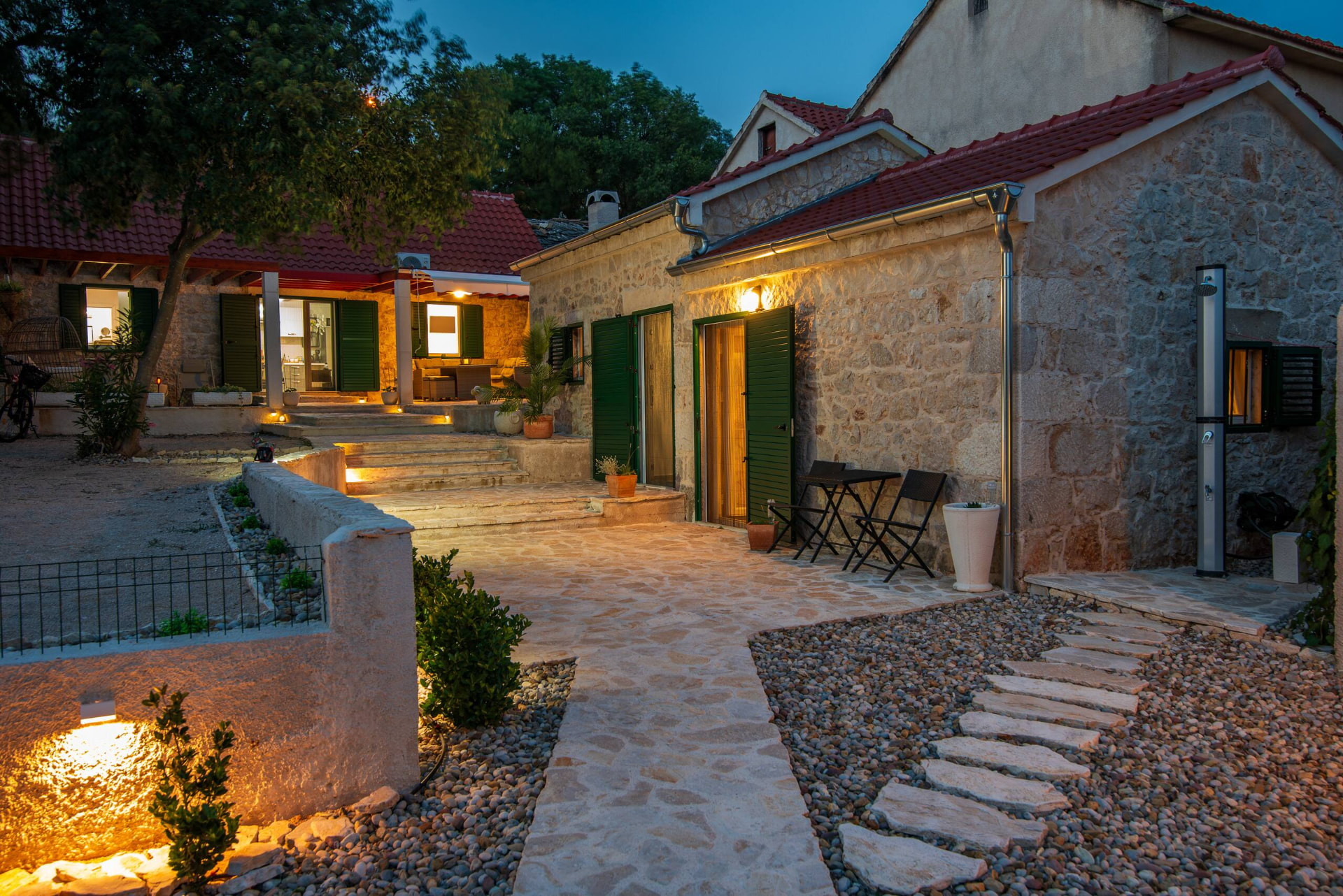 Private stone courtyard with lavender and olive trees