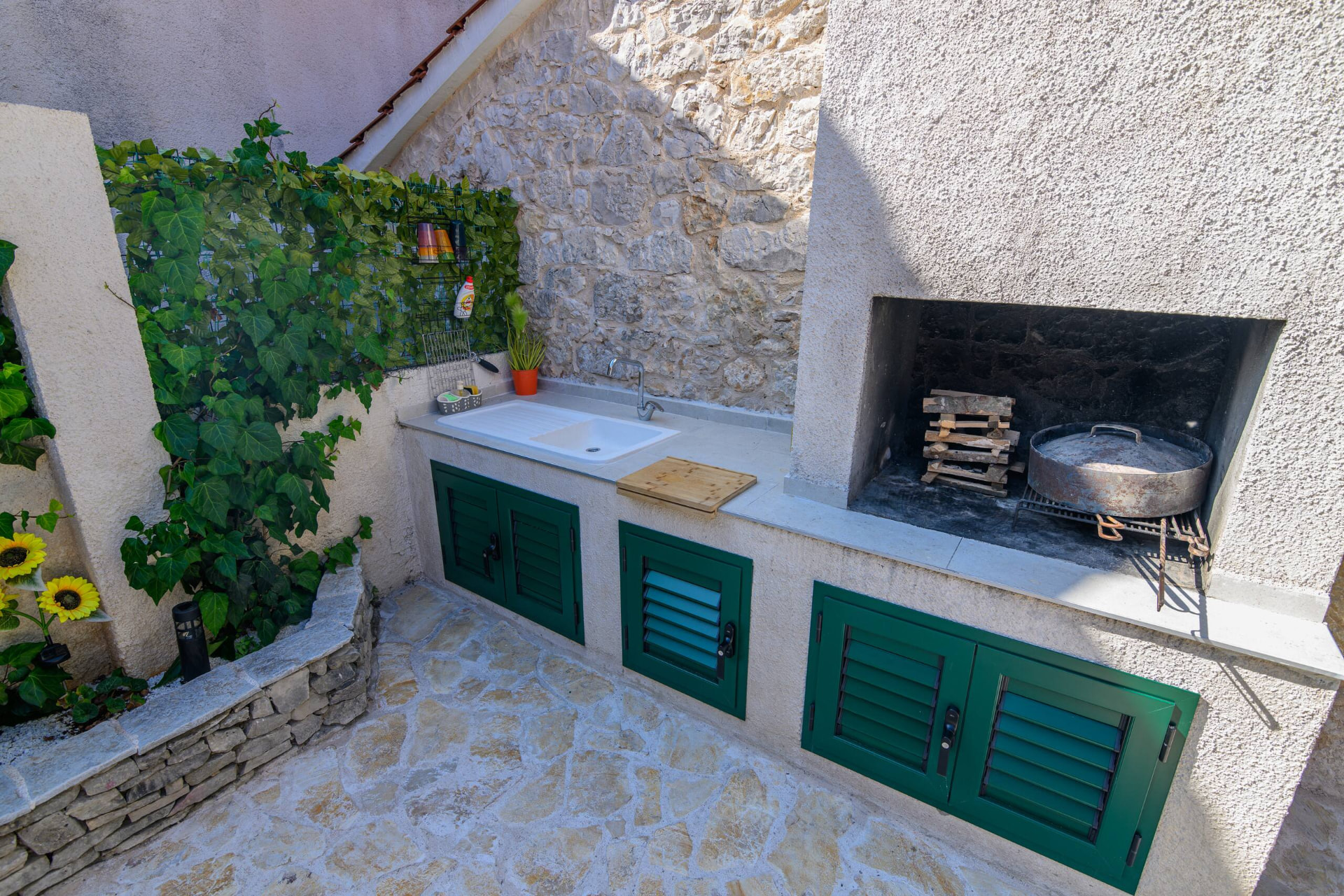 Outdoor dining table and stone barbecue