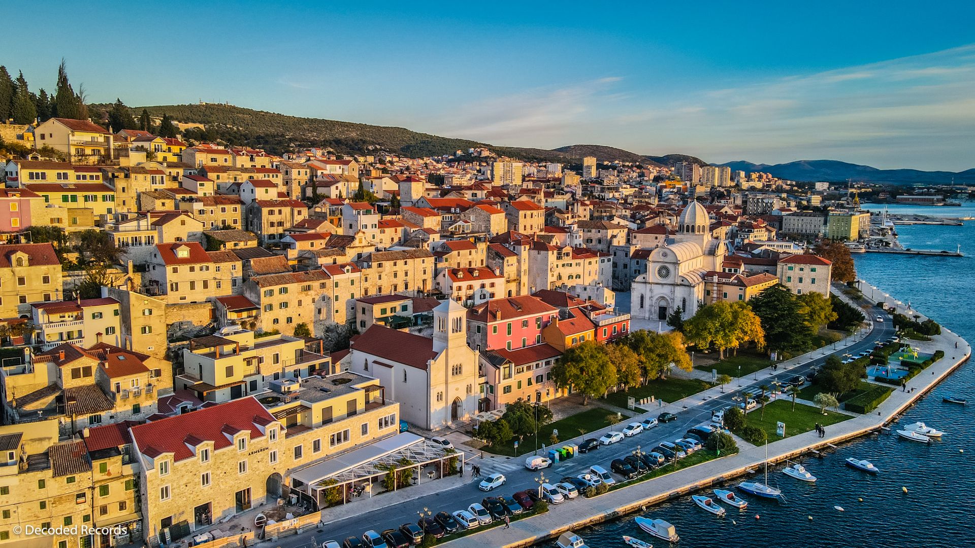 Aerial view of Šibenik old town and harbor at golden hour