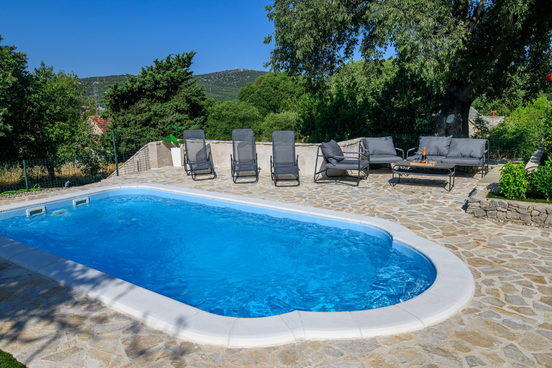 Private swimming pool in daylight